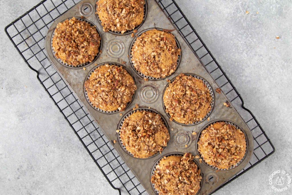 baked pumpkin muffins on a wire rack cooling