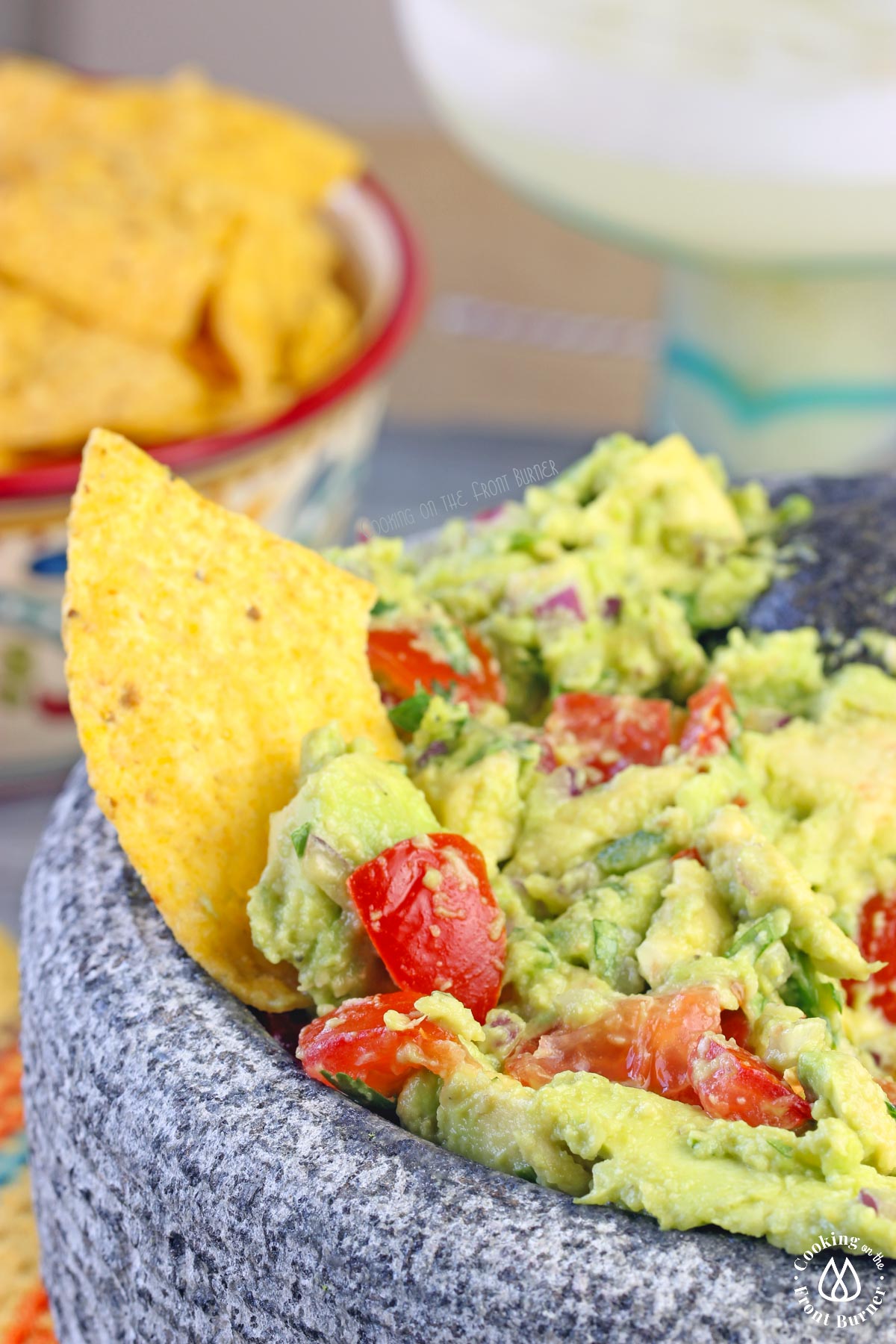 a tortilla chip in guacamole