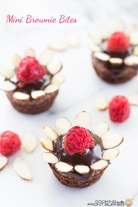 Pick a bunch of posies - I mean flower brownie bites! These are easy and fun to make and the perfect bite sized treat! Mini Brownie Bites with Raspberries and Ganache | Cooking on the Front Burner