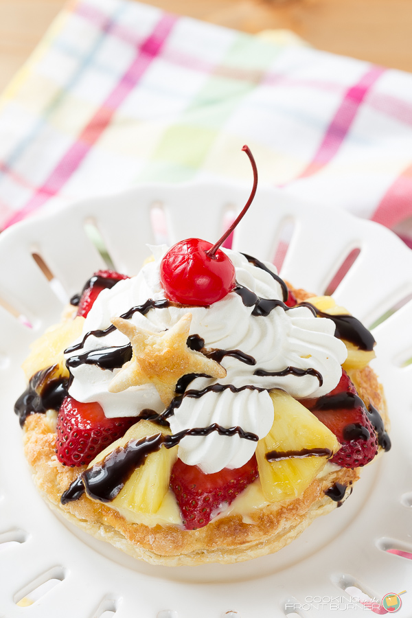 Mini Banana Split Pastry Dessert on a white plate on a colored napkin