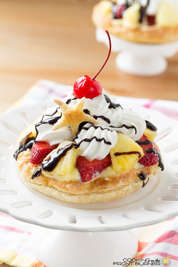 Mini Banana Split Pastry Desserts have it all - bananas, pineapple, strawberries and chocolate, all topped off with a cherry! An easy dessert, but so pretty, it looks like you have fussed all day!