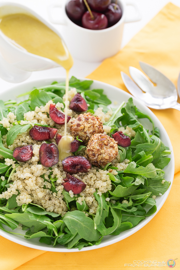 A delightful salad with fresh cherries, arugula, quinoa, goat cheese and a lemony honey mustard vinaigrette Arugula Quinoa Salad with Creamy Lemon Vinaigrette | Cooking on the Front Burner