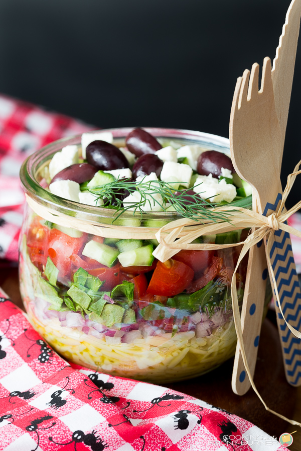 jar with orzo tomatoes cucumbers olives feta