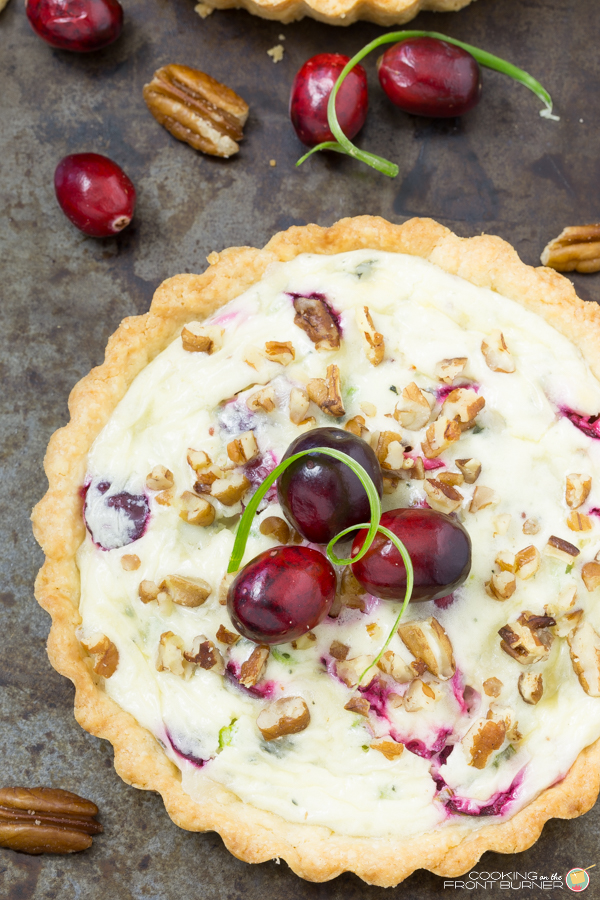 These individual Cranberry Gorgonzola tarts is the perfect recipe to have on hand for your next party or happy hour! Cranberry Gorgonzola Tart | Cooking on the Front Burner