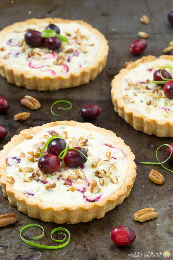These individual Cranberry Gorgonzola tarts is the perfect recipe to have on hand for your next party or happy hour! Cranberry Gorzonzola Tart | Cooking on the Front Burner