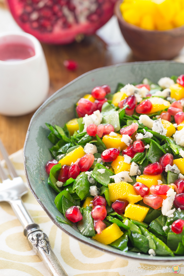This tasty Chopped Spinach Salad with Pomegranate and Mango is a great way to get your veggies Chopped Spinach Pomegranate Salad | Cooking on the Front Burner