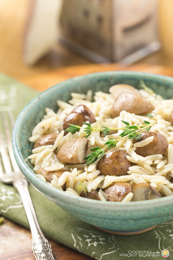 You will love the flavor of this tasty orzo pasta cooked with baby bellas, fresh thyme and a splash of wine - made in under 30 minutes! A perfect side dish! Quick Mushroom Orzo Pasta | Cooking on the Front Burner