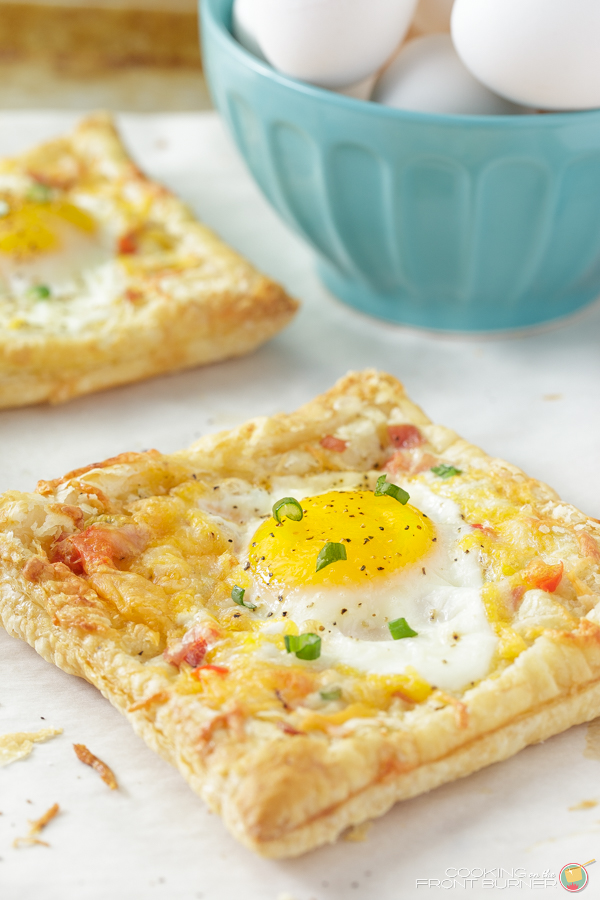 puff pastry with a cooked egg on it with cheese on a white board