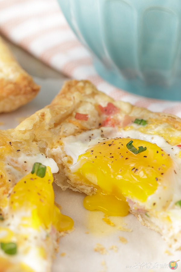 puff pastry with a cooked egg cut in half