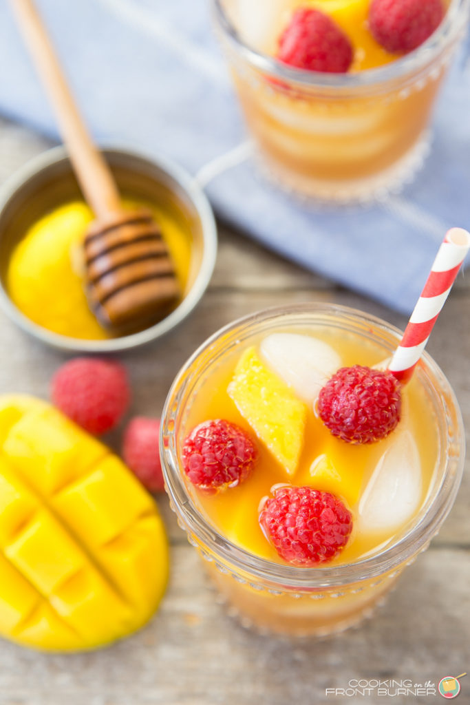 Raspberry mango iced tea is the perfect cold drink for summer! This iced tea recipe uses fresh raspberries and mango, giving the iced tea a burst of refreshing fruit flavor.