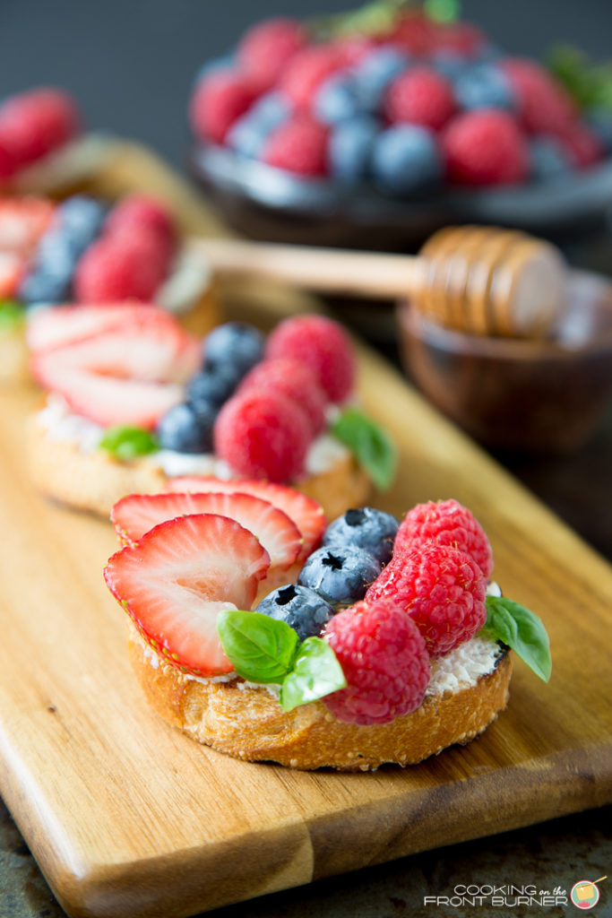 You will love how quick this Triple Berry Bruschetta comes together with a bit of honey and a touch of basil. Triple Berry Bruschetta | Cooking on the Front Burner