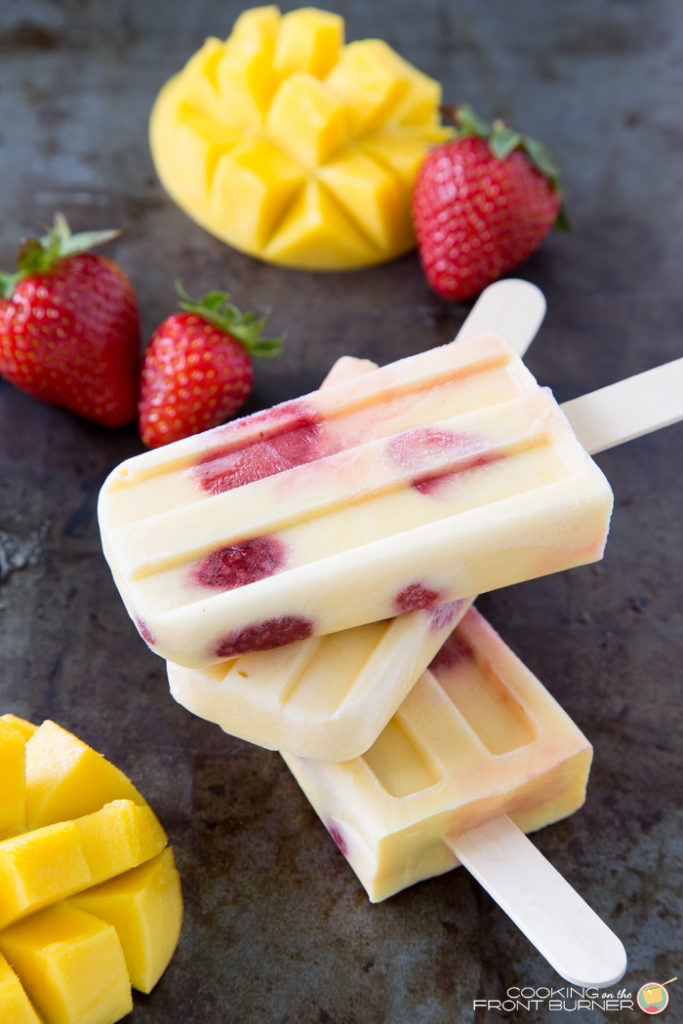 Mango strawberry yogurt popsicles - a refreshing summer treat made with only 4 ingredients! This frozen dessert recipe will keep you cool all summer long.