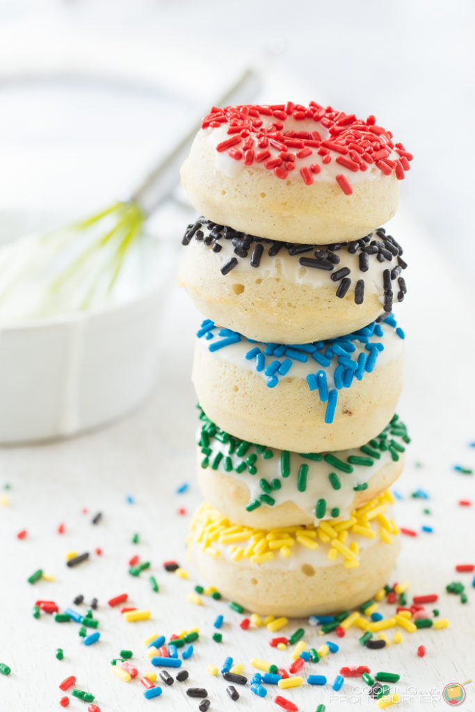 Cheer on team USA with these mini sized and baked Olympic donuts. A great idea or snacking or breakfast. Olympic Mini Donuts with Sprinkles