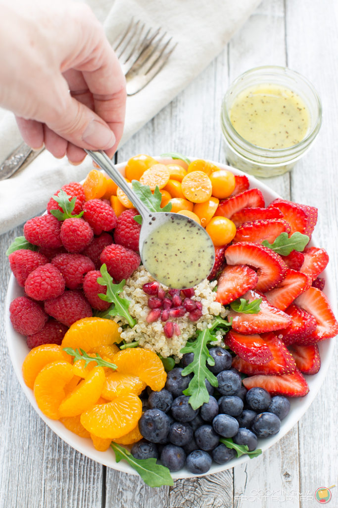 Quinoa salad with fresh berries, arugula, and orange poppy seed vinaigrette makes the perfect healthy dinner!