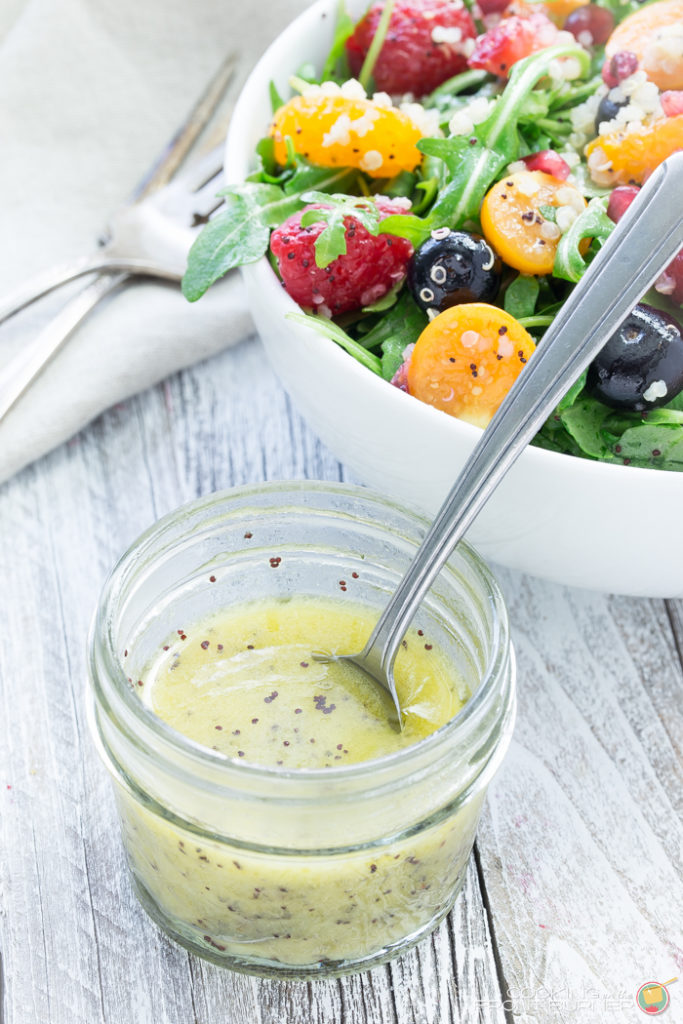 Quinoa salad with fresh berries, arugula, and orange poppy seed vinaigrette makes the perfect healthy dinner!