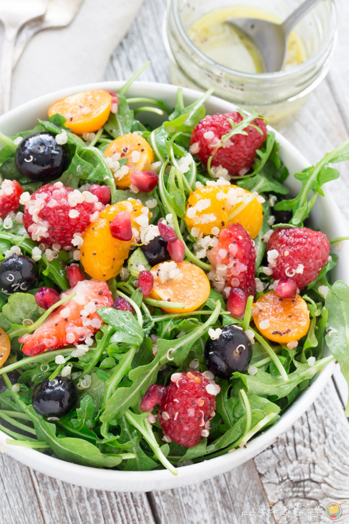 Quinoa salad with fresh berries, arugula, and orange poppy seed vinaigrette makes the perfect healthy dinner!