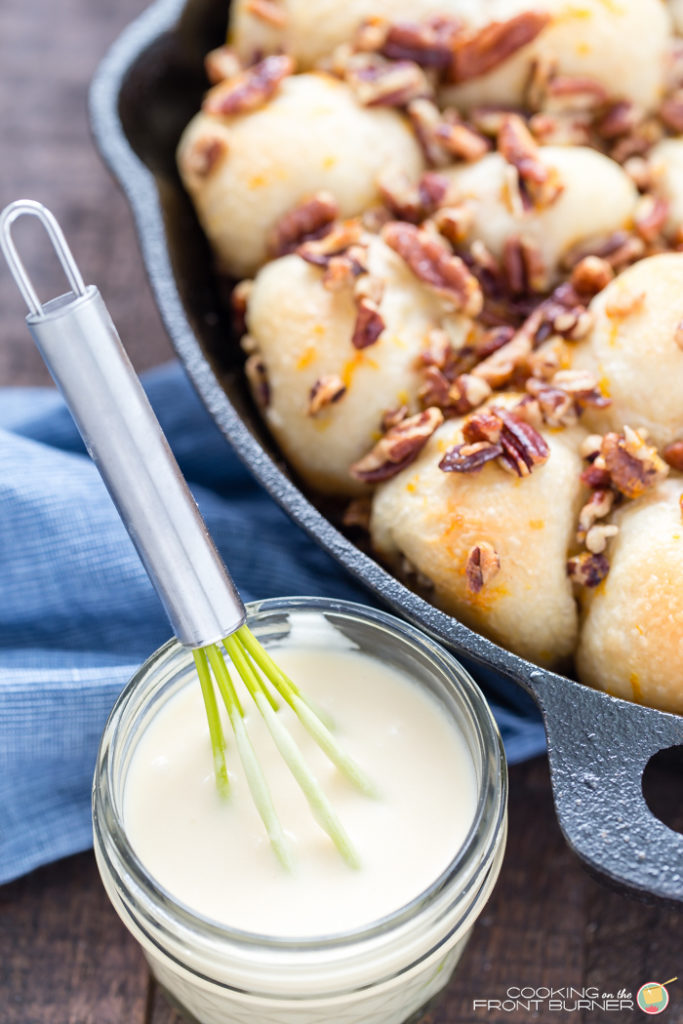 Orange Pecan Pull Apart skillet rolls will become your favorite breakfast treat! With creamy orange glaze and crunchy pecans, these pull apart rolls are great for breakfast, brunch, or holidays.