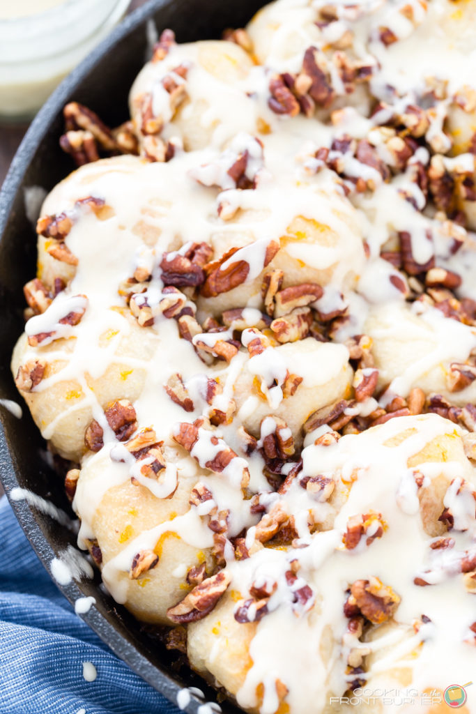Orange Pecan Pull Apart skillet rolls will become your favorite breakfast treat! With creamy orange glaze and crunchy pecans, these pull apart rolls are great for breakfast, brunch, or holidays.