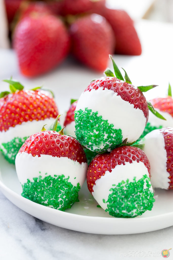 These juicy strawberries are all decked out for Cinco de Mayo. They are dipped in white chocolate and jazzed up with green sprinkles! fresh strawberries dipped in white chocolate and dipped in green sprinkles