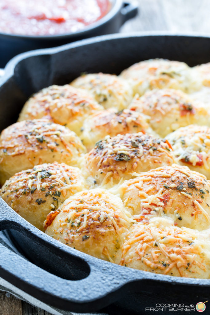 Pull apart pizza rolls make the perfect snack or dinner option. They are little, light, fluffy pillows topped with Italian seasonings, cheese and pepperoni tucked in between.