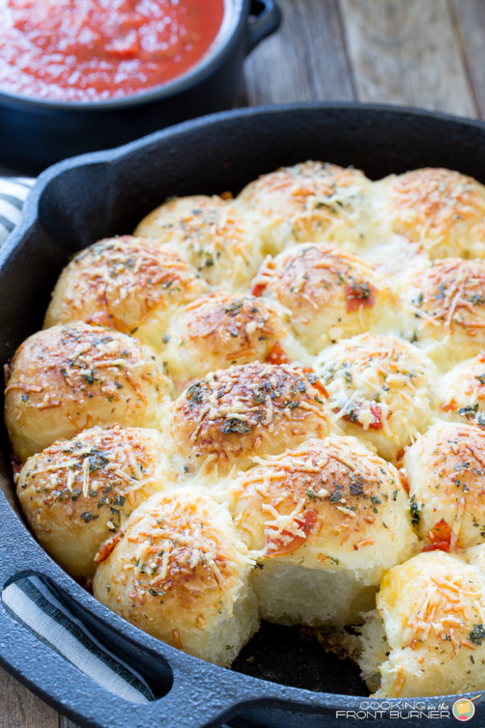 Pull apart pizza rolls make the perfect snack or dinner option. They are little, light, fluffy pillows topped with Italian seasonings, cheese and pepperoni tucked in between.