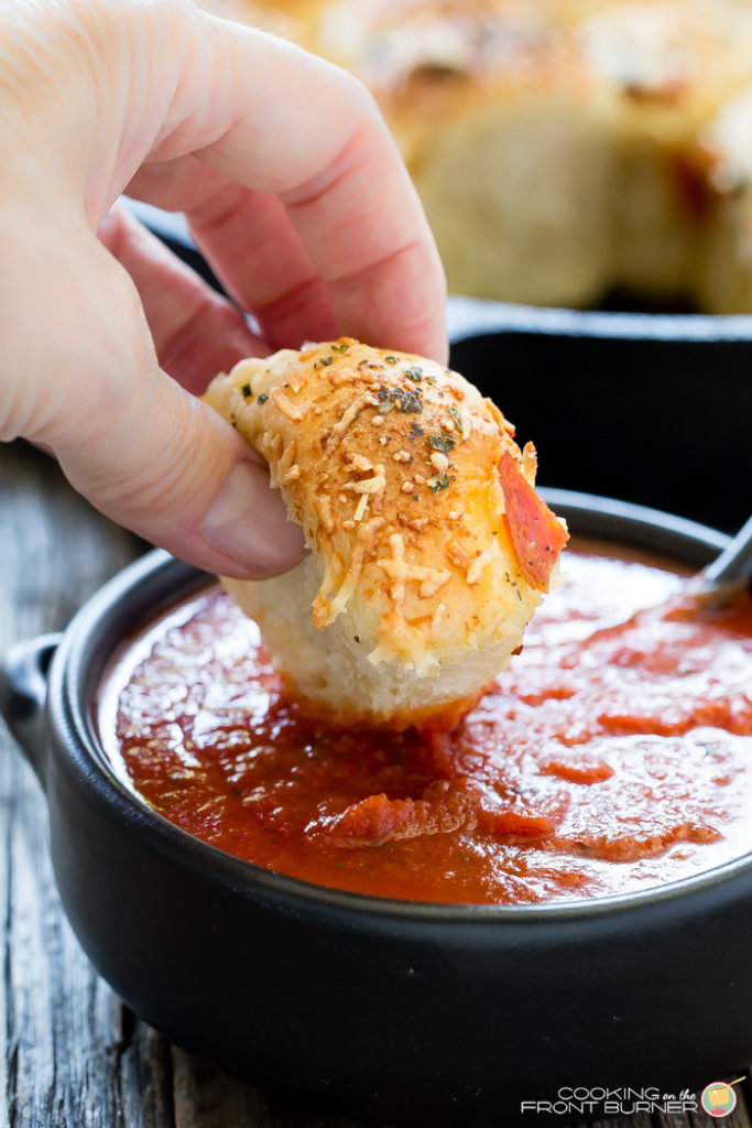 Pull apart pizza rolls make the perfect snack or dinner option. They are little, light, fluffy pillows topped with Italian seasonings, cheese and pepperoni tucked in between.