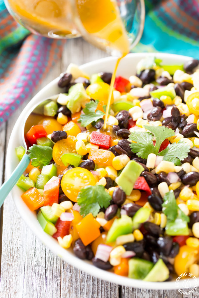 How does this easy black bean and corn salad sound? It is loaded with fresh ingredients and drizzled with a chili lime vinaigrette. You'll want to serve this soon and often!