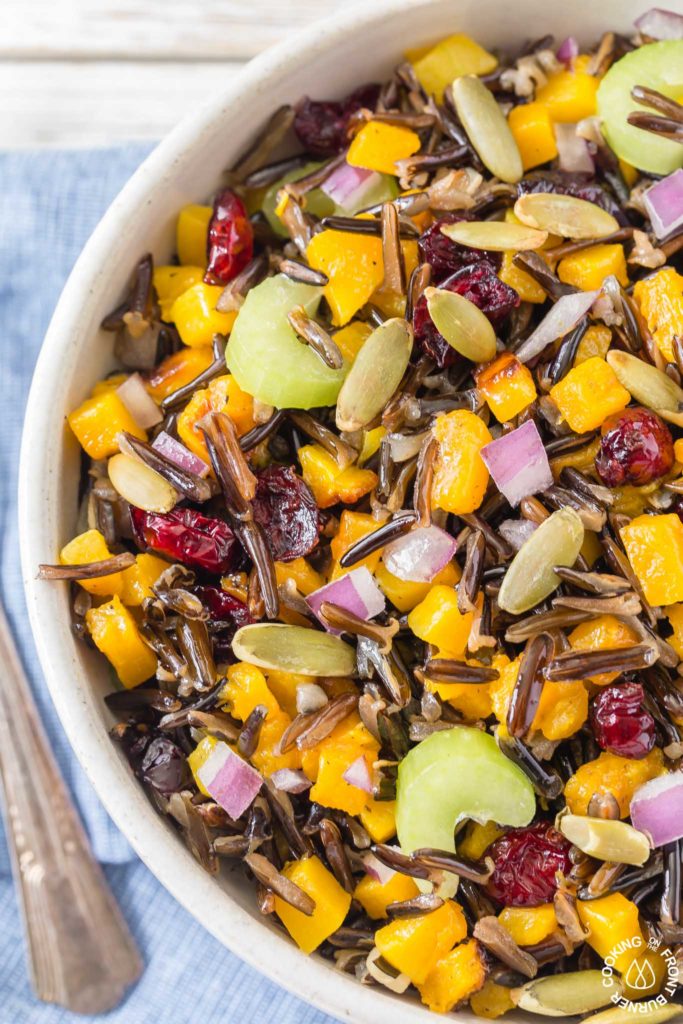 This Butternut Squash and Wild Rice Salad starts with roasted squash and Minnesota wild rice then tossed with crunchy celery, sweet dried cranberries, pumpkins seeds and drizzled with a maple walnut vinaigrette.  Perfect for fall, holidays or any time!