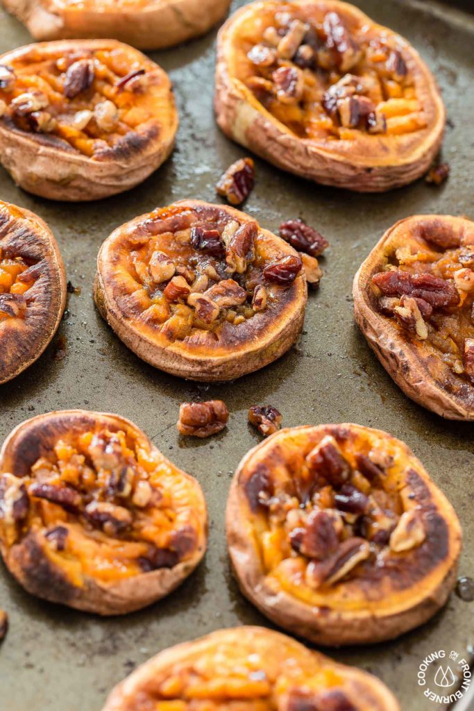 These Smashed Sweet Potatoes are the perfect side dish for any occasion.  The sweet potatoes are roasted with cinnamon, a bit of chili powder and topped with crunchy toasted maple pecans!