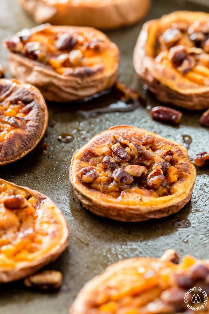 These Smashed Sweet Potatoes are the perfect side dish for any occasion.  The sweet potatoes are roasted with cinnamon, a bit of chili powder and topped with crunchy toasted maple pecans!