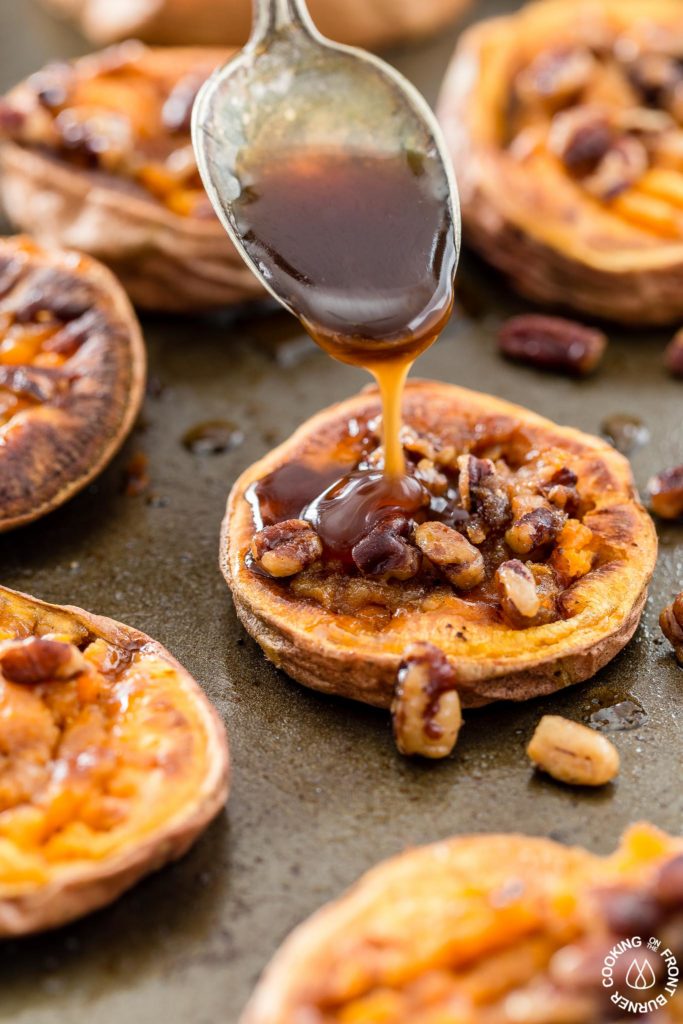 These Smashed Sweet Potatoes are the perfect side dish for any occasion.  The sweet potatoes are roasted with cinnamon, a bit of chili powder and topped with crunchy toasted maple pecans!