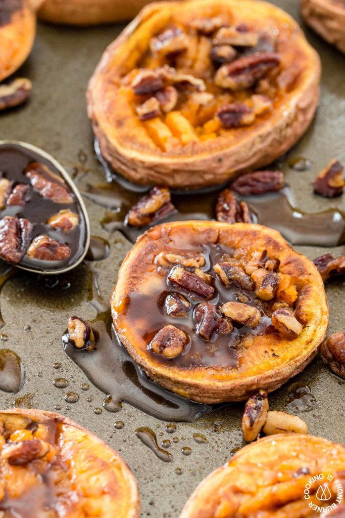 These Smashed Sweet Potatoes are the perfect side dish for any occasion.  The sweet potatoes are roasted with cinnamon, a bit of chili powder and topped with crunchy toasted maple pecans!