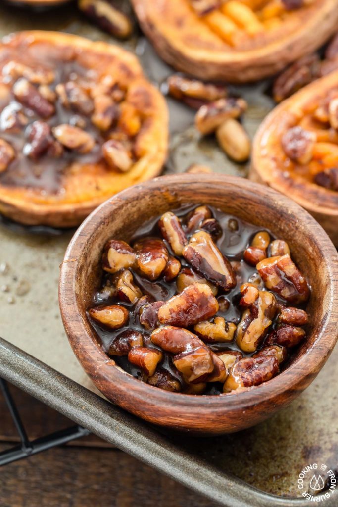 These Smashed Sweet Potatoes are the perfect side dish for any occasion.  The sweet potatoes are roasted with cinnamon, a bit of chili powder and topped with crunchy toasted maple pecans!