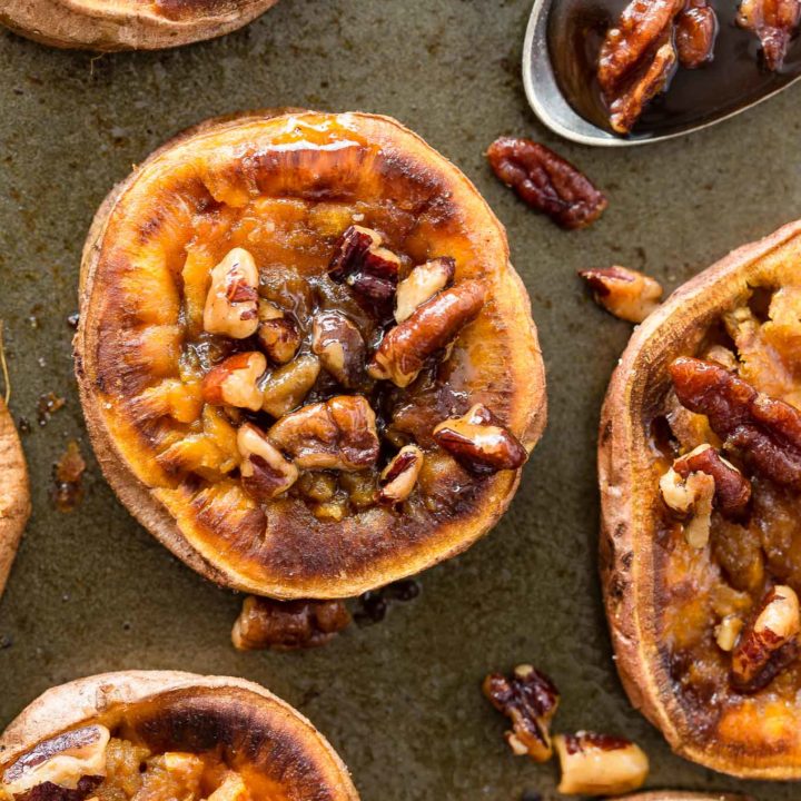 These Smashed Sweet Potatoes are the perfect side dish for any occasion.  The sweet potatoes are roasted with cinnamon, a bit of chili powder and topped with toasted maple pecans!