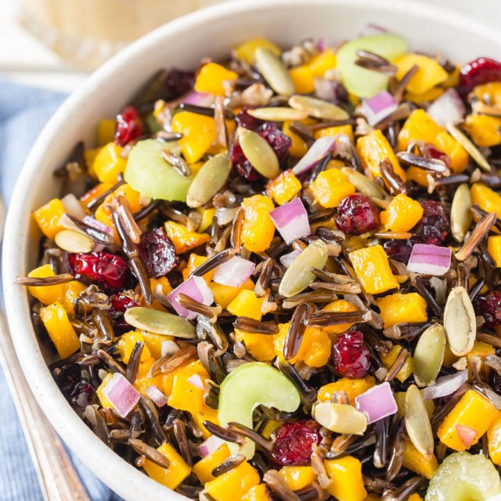 This Butternut Squash and Wild Rice Salad starts with roasted squash and Minnesota wild rice then tossed with crunchy celery, sweet dried cranberries, pumpkins seeds and drizzled with a maple walnut vinaigrette.  Perfect for fall, holidays or any time!