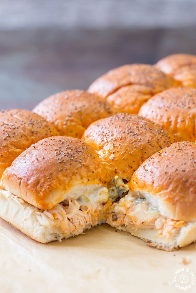 Your game day will be kicked up a notch with these Easy Buffalo Chicken Sliders!  The perfect party size sandwich with the right amount of spice, creamy blue cheese and some crunchy celery.