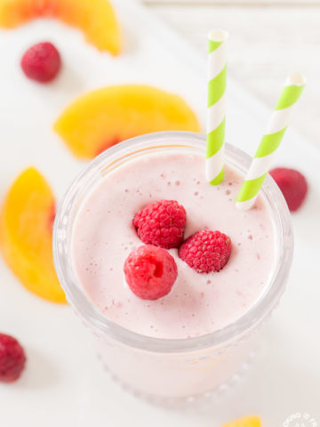 Making this Healthy Peach Raspberry Smoothie is easy to prepare and makes a delicious breakfast beverage or snack. It is so simple with frozen raspberries and peaches with yogurt, soy milk and a touch of honey.