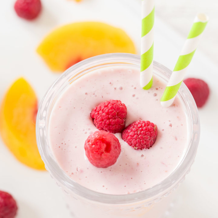 Making this Healthy Peach Raspberry Smoothie is easy to prepare and makes a delicious breakfast beverage or snack. It is so simple with frozen raspberries and peaches with yogurt, soy milk and a touch of honey.
