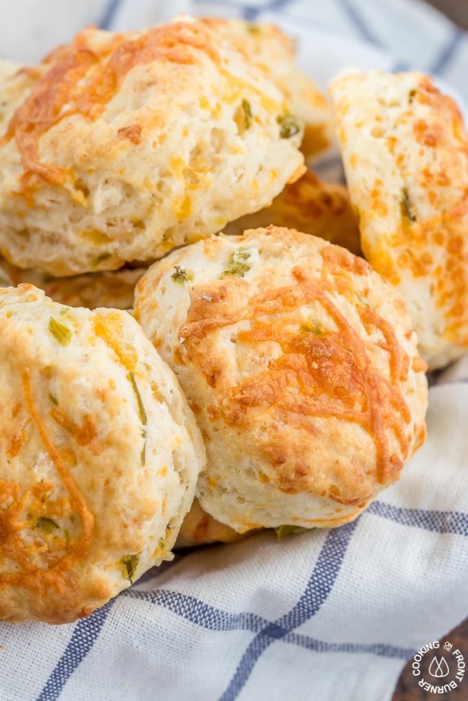 These Green Chile Cheddar Biscuits are perfect with a bowl of your favorite soup or chili.  They are light, fluffy and kicked up a notch with green chilies.  Eating them by themselves is a good snack idea too!