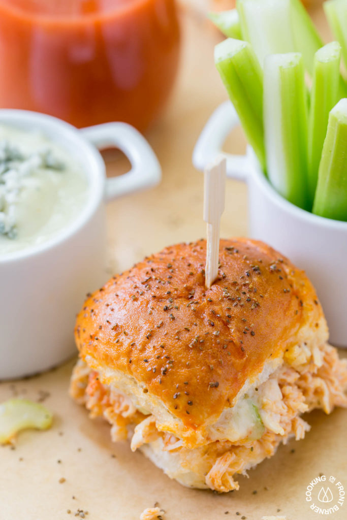 Your game day will be kicked up a notch with these Easy Buffalo Chicken Sliders!  The perfect party size sandwich with the right amount of spice, creamy blue cheese and some crunch celery.