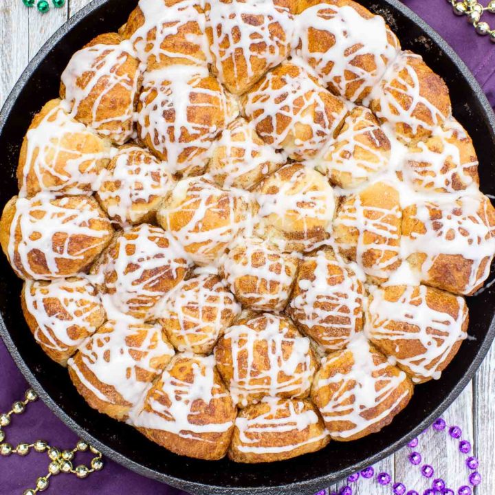 Your taste buds will be tantalized with these Skillet Cinnamon Rolls.  They are easy to make by starting with frozen rolls, the right amount of cinnamon and sugar and drizzled with a vanilla glaze.  Your kitchen will smell amazing too while they are baking!
