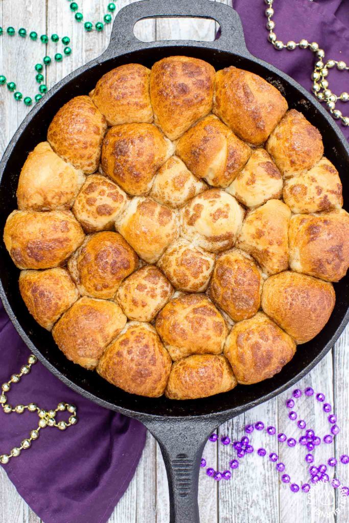 Your taste buds will be tantalized with these Skillet Cinnamon Rolls.  They are easy to make by starting with frozen rolls, the right amount of cinnamon and sugar and drizzled with a vanilla glaze.  Your kitchen will smell amazing too while they are baking! #breakfast #skilletrolls #cinnamon rolls