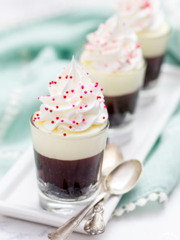 These no-bake Double Chocolate Mousse Shooters make the perfect mini dessert.  They have an chocolate crumb crust, a dark chocolate truffle layer then topped with a creamy white chocolate mousse.  You can even have more than one, I'll never tell!