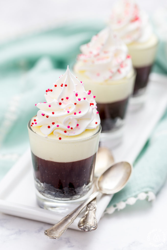 These no-bake Double Chocolate Mousse Shooters make the perfect mini dessert.  They have an chocolate crumb crust, a dark chocolate truffle layer then topped with a creamy white chocolate mousse.  You can even have more than one, I'll never tell!