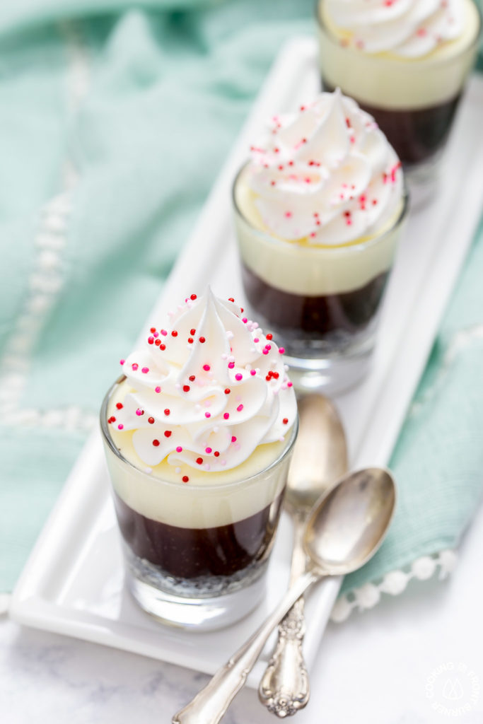 These no-bake Double Chocolate Mousse Shooters make the perfect mini dessert.  They have an chocolate crumb crust, a dark chocolate truffle layer then topped with a creamy white chocolate mousse.  You can even have more than one, I'll never tell!