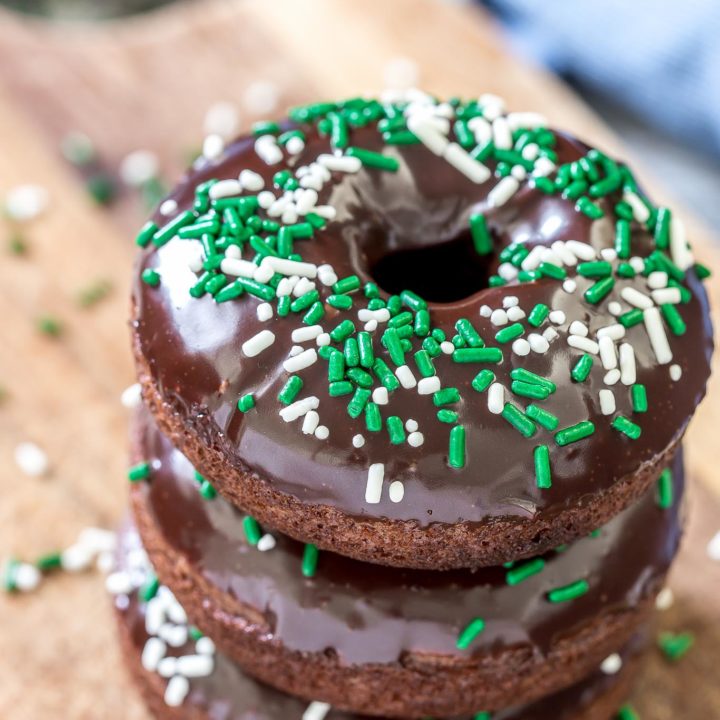 These chocolate Irish Cream Glazed Donuts are baked - not fried - and have a thick layer of chocolate ganache and festive sprinkles.  They are so easy to make and are perfect for breakfast for a sweet treat!