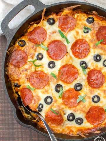 In 30 minutes you can serve this Pizza Tortellini Skillet Casserole on the family table.  Talk about freaky fast and delicious!  It's a very comforting dish with tender cheese pasta, a rich marinara sauce, pepperoni, olives and two kinds of cheeses and all baked in one skillet!   #skillet #pasta #casserole