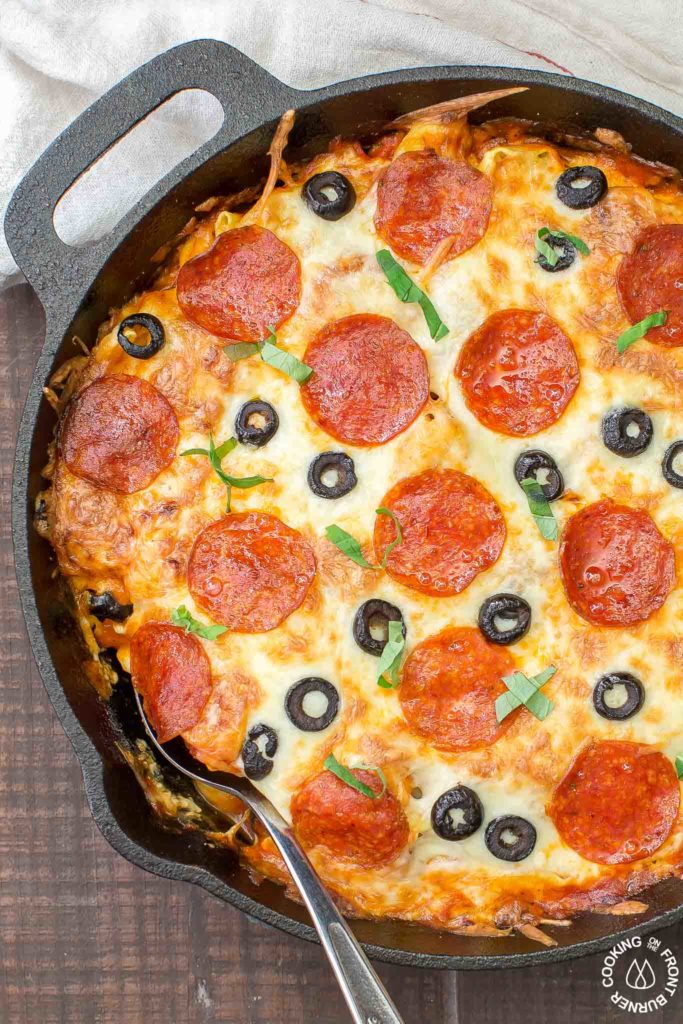 In 30 minutes you can serve this Pizza Tortellini Skillet Casserole on the family table.  Talk about freaky fast and delicious!  It's a very comforting dish with tender cheese pasta, a rich marinara sauce, pepperoni, olives and two kinds of cheeses and all baked in one skillet!   #skillet #pasta #casserole