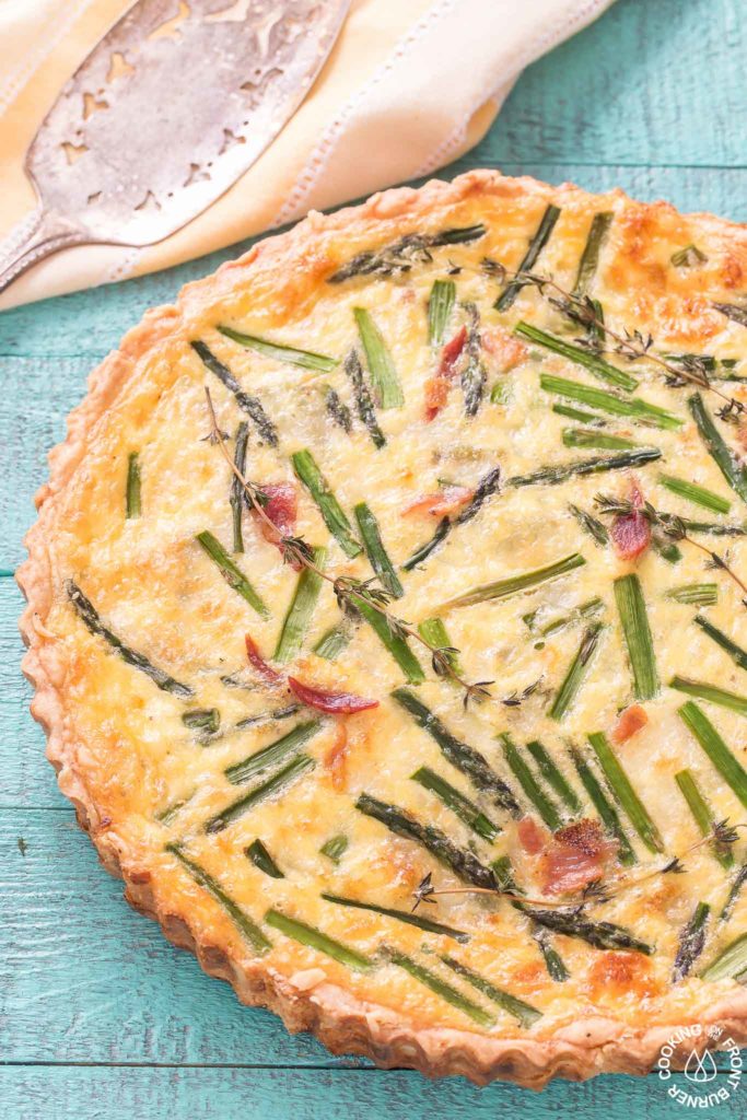 close up picture of asparagus and leek quiche