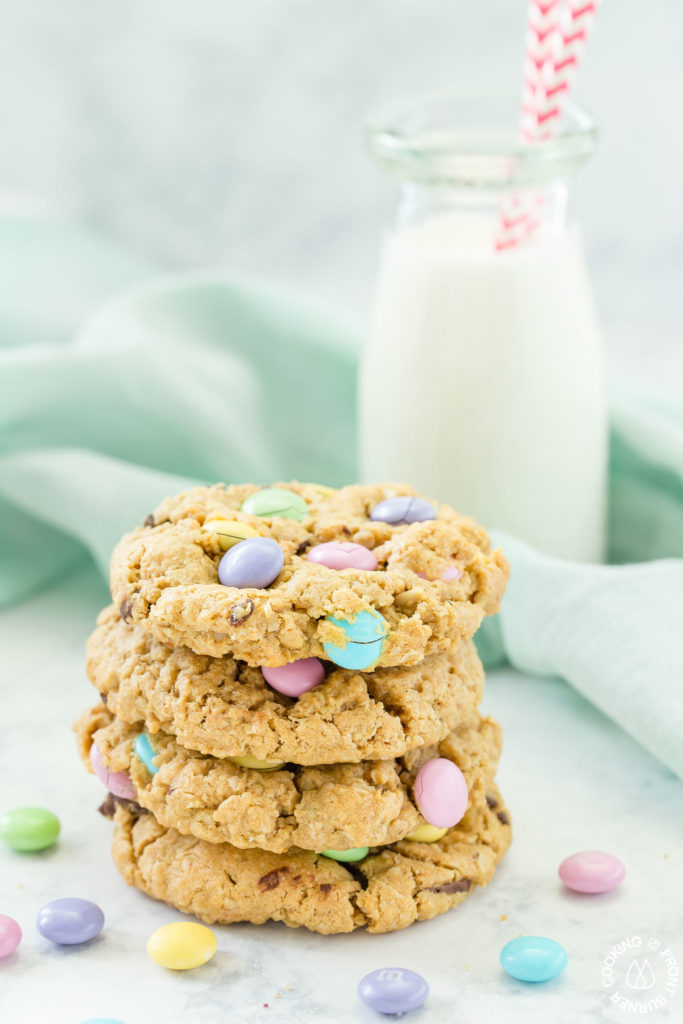 stack of easter monster cookies with milk